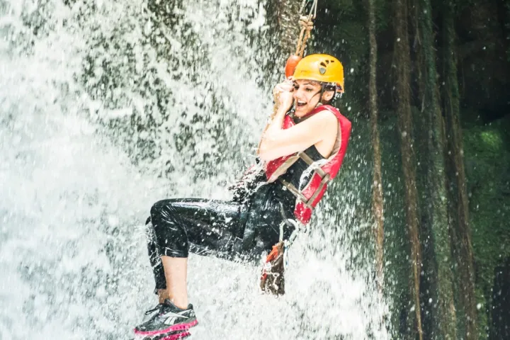 a man riding a wave on a surfboard in the water