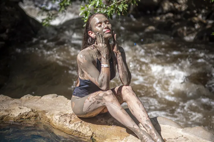a man riding on top of a rock