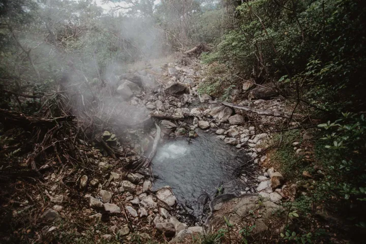 a large waterfall in a forest