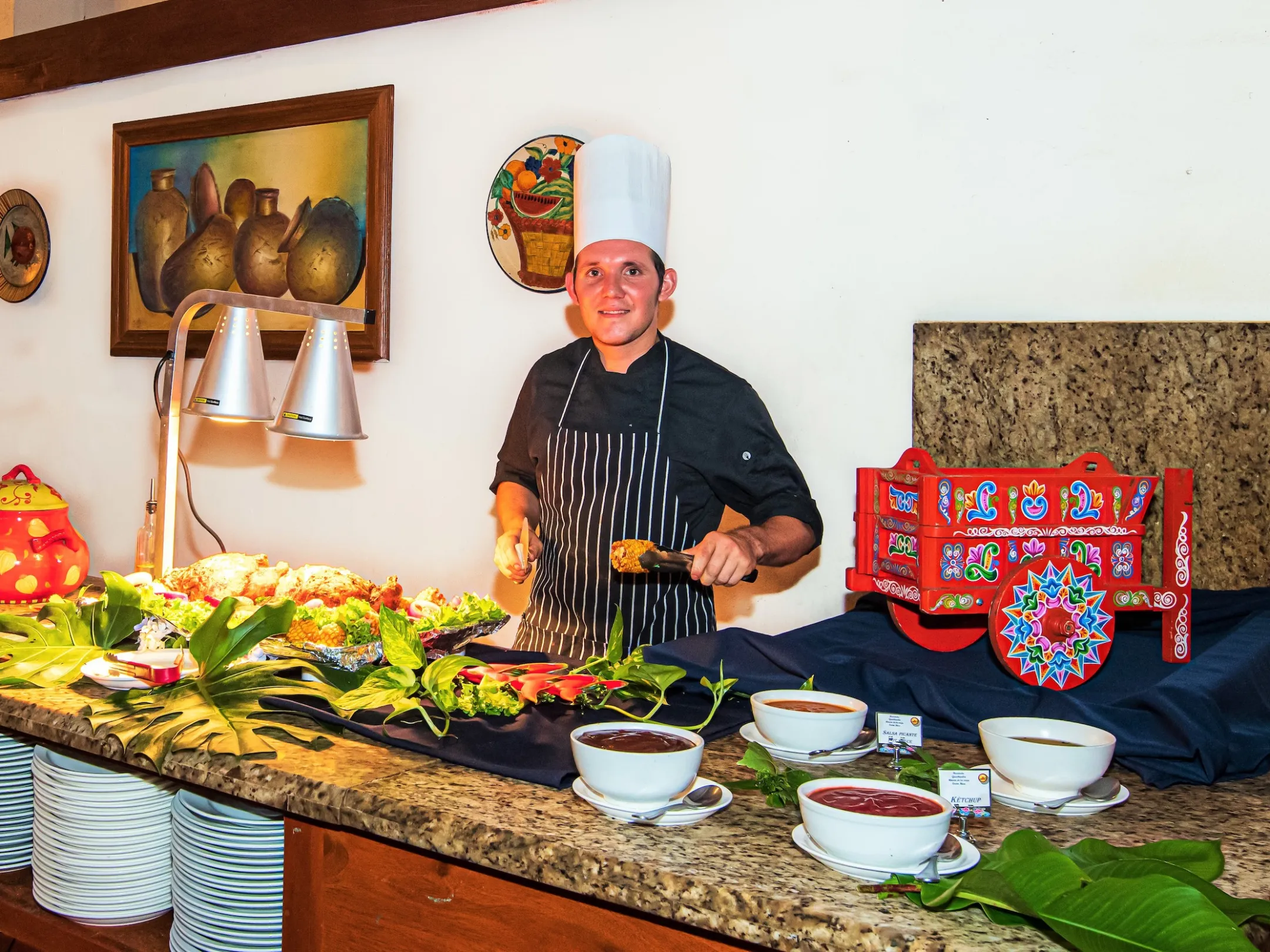 Chef serving food at Hotel Hacienda Guachpelin