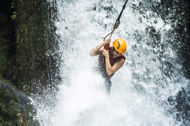 a man riding a wave on a surfboard in the water