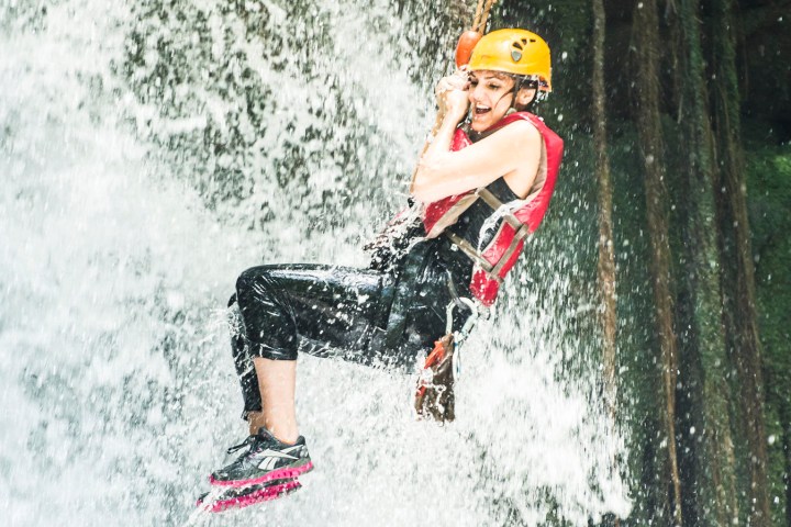a person riding a snow board in the water