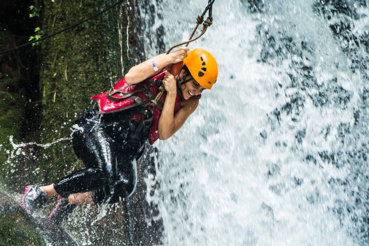a man riding a wave on a surfboard in the water