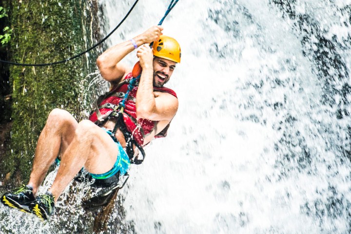 a person riding a surf board in the air