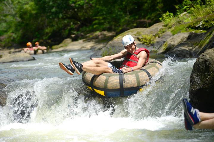 a person riding a surf board on a body of water