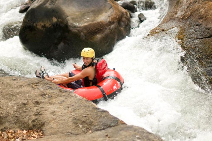 a man in a red raft in the snow