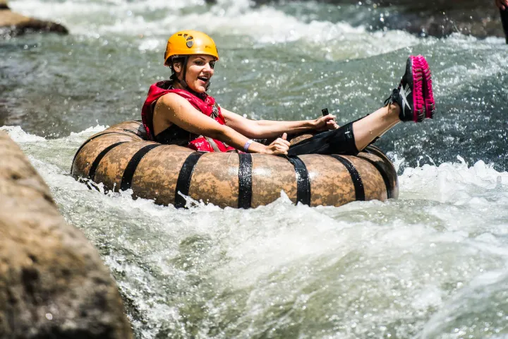 a person riding a surf board on a body of water