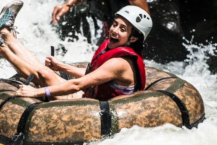 a person that is sitting in the snow