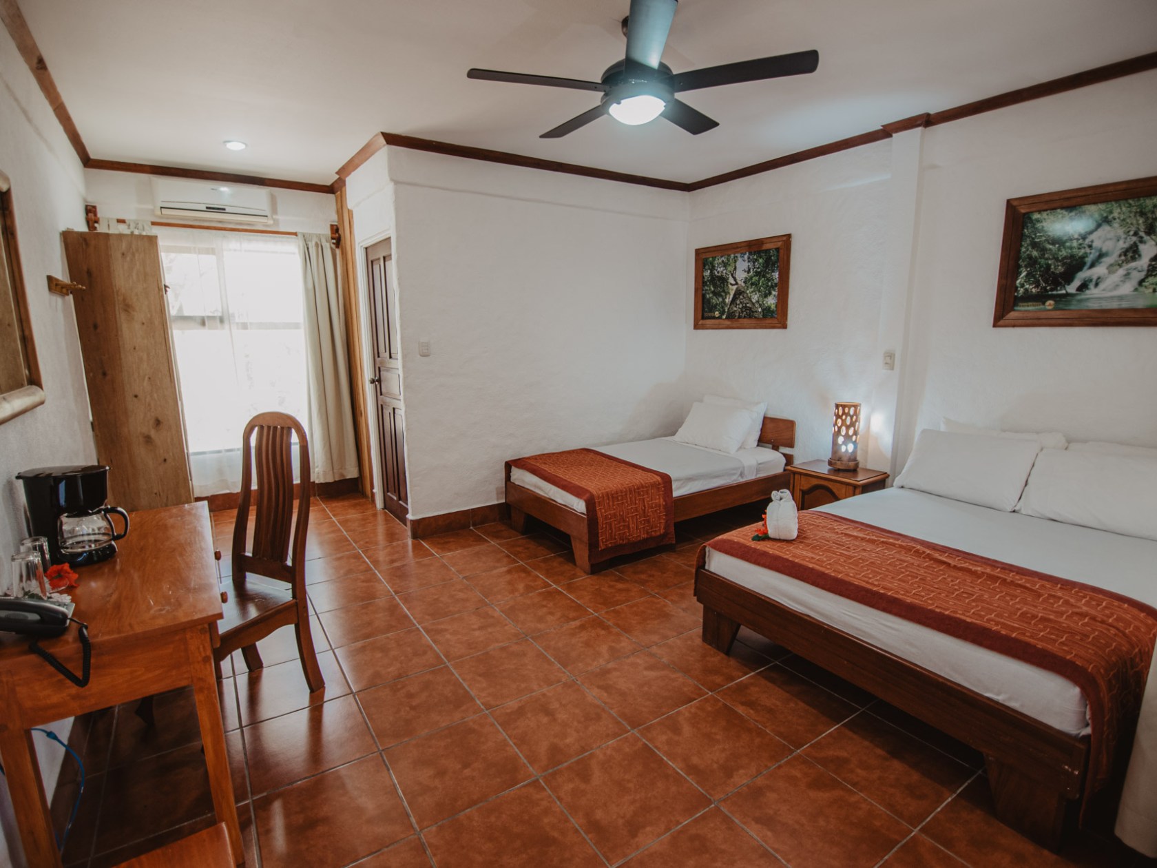 a bedroom with a wooden floor