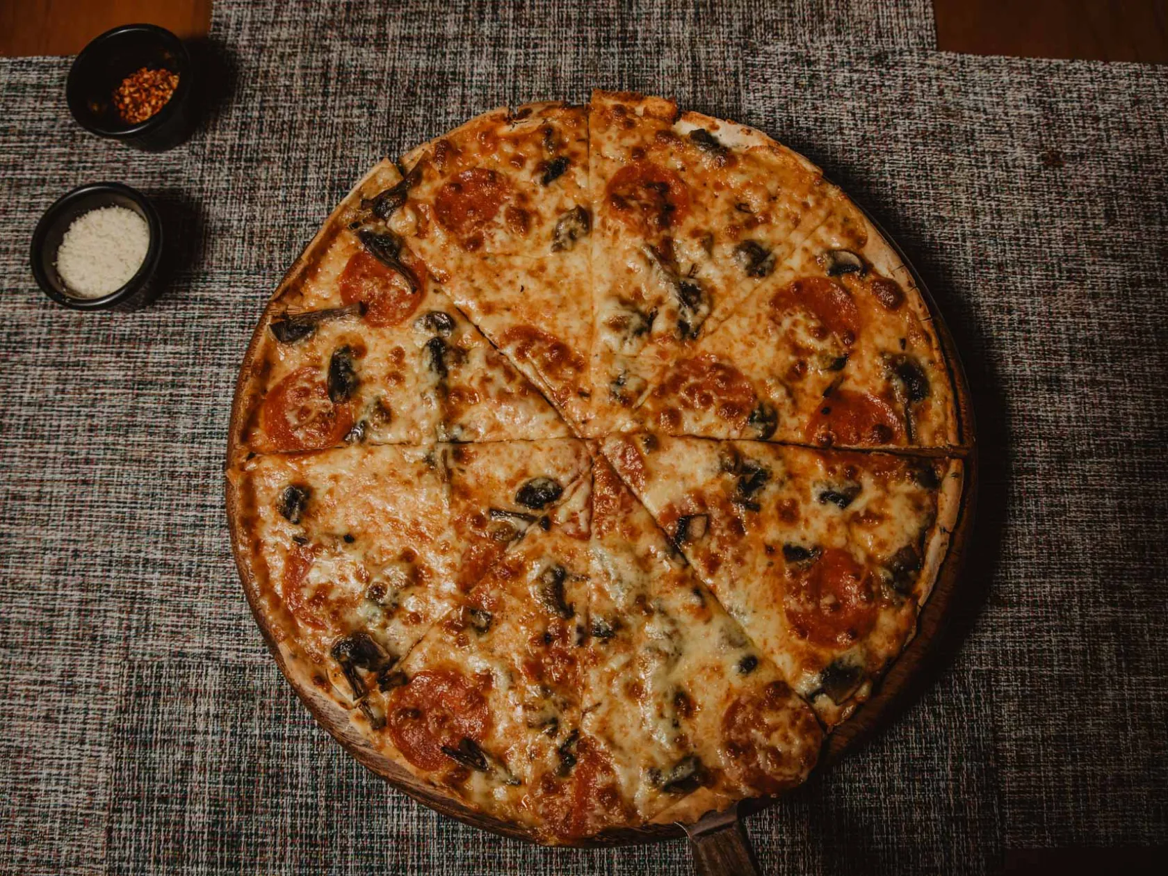 a pizza sitting on top of a table