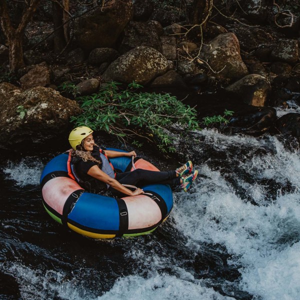 a person riding a surf board on a body of water