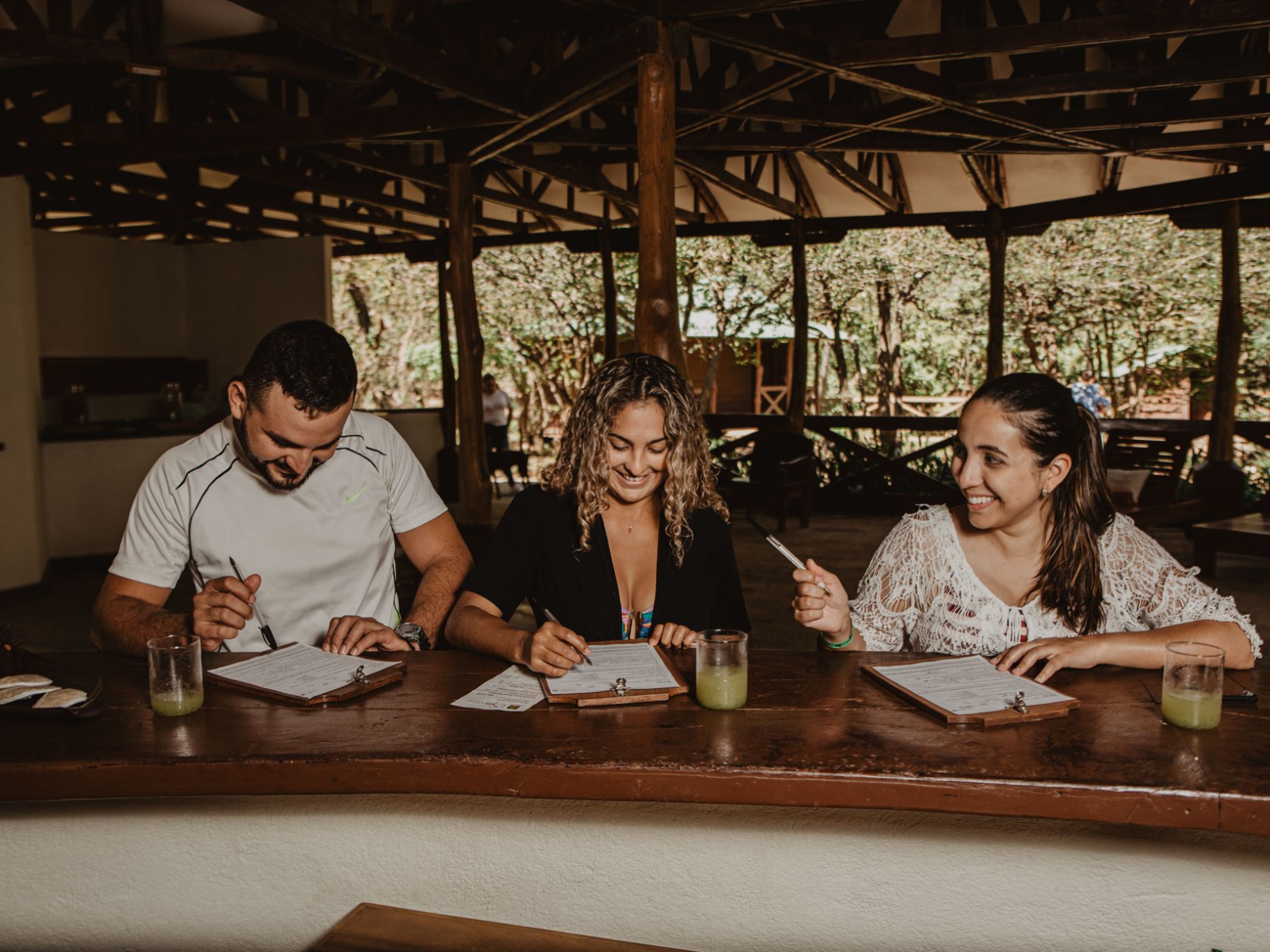 Ayesha Depala et al. sitting at a table drinking wine