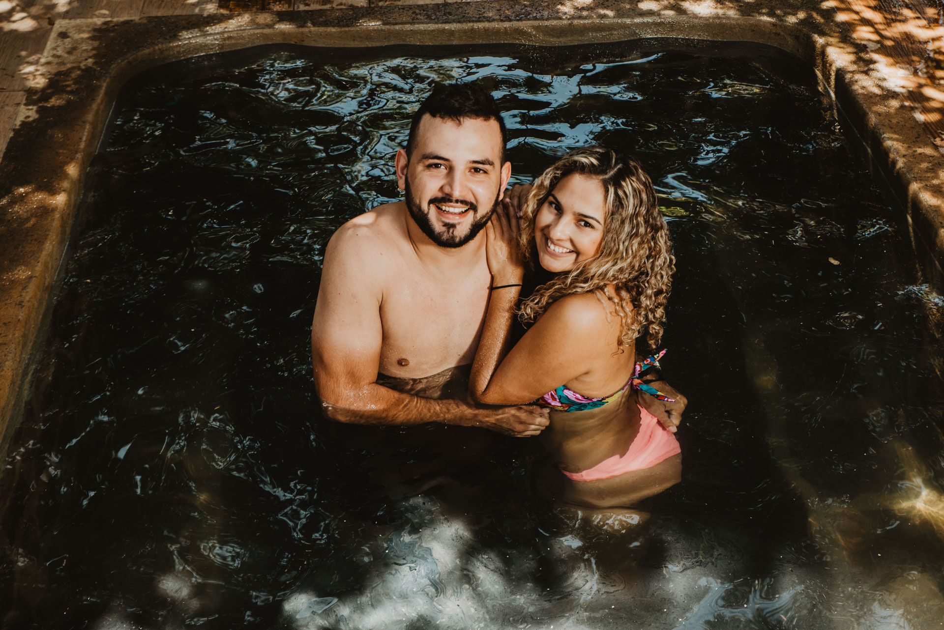 a person standing next to a body of water