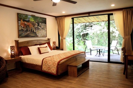 a living room filled with furniture and a large window