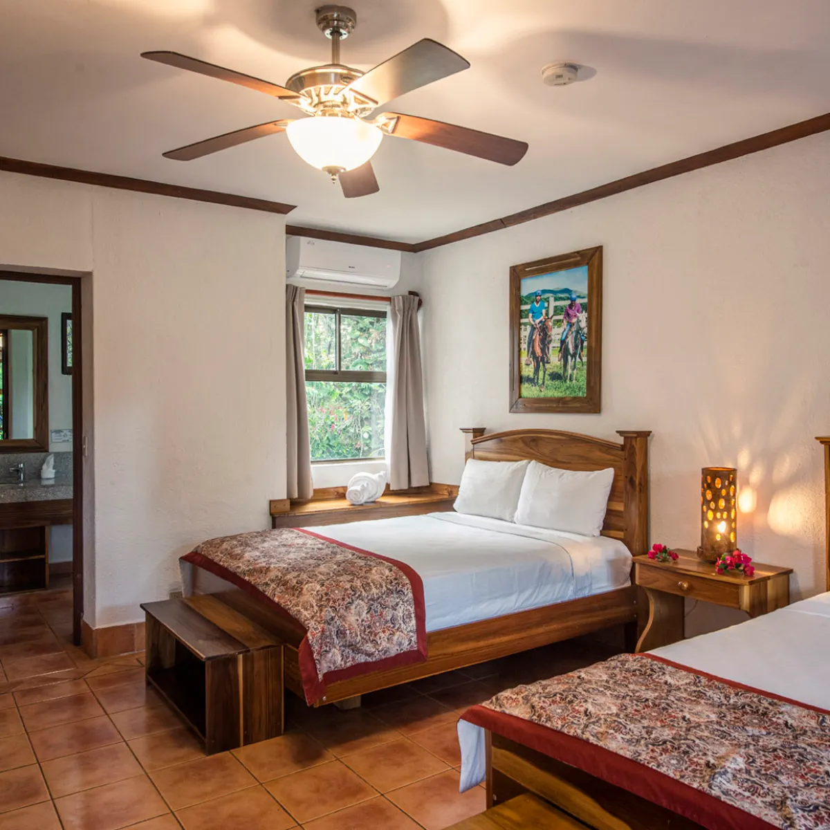a living room with a bed and a fireplace