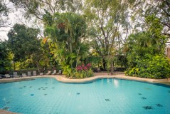 a pool next to a body of water