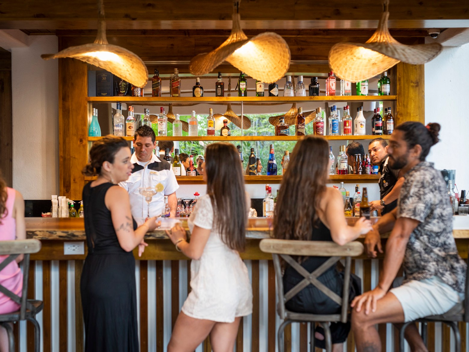 a group of people sitting at a table in a restaurant