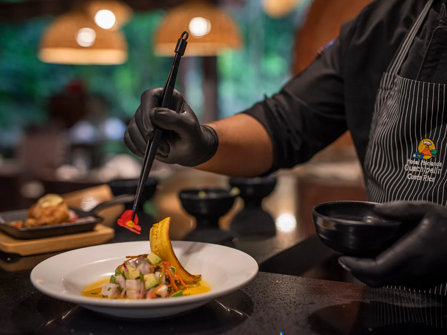 a person sitting at a table with a plate of food