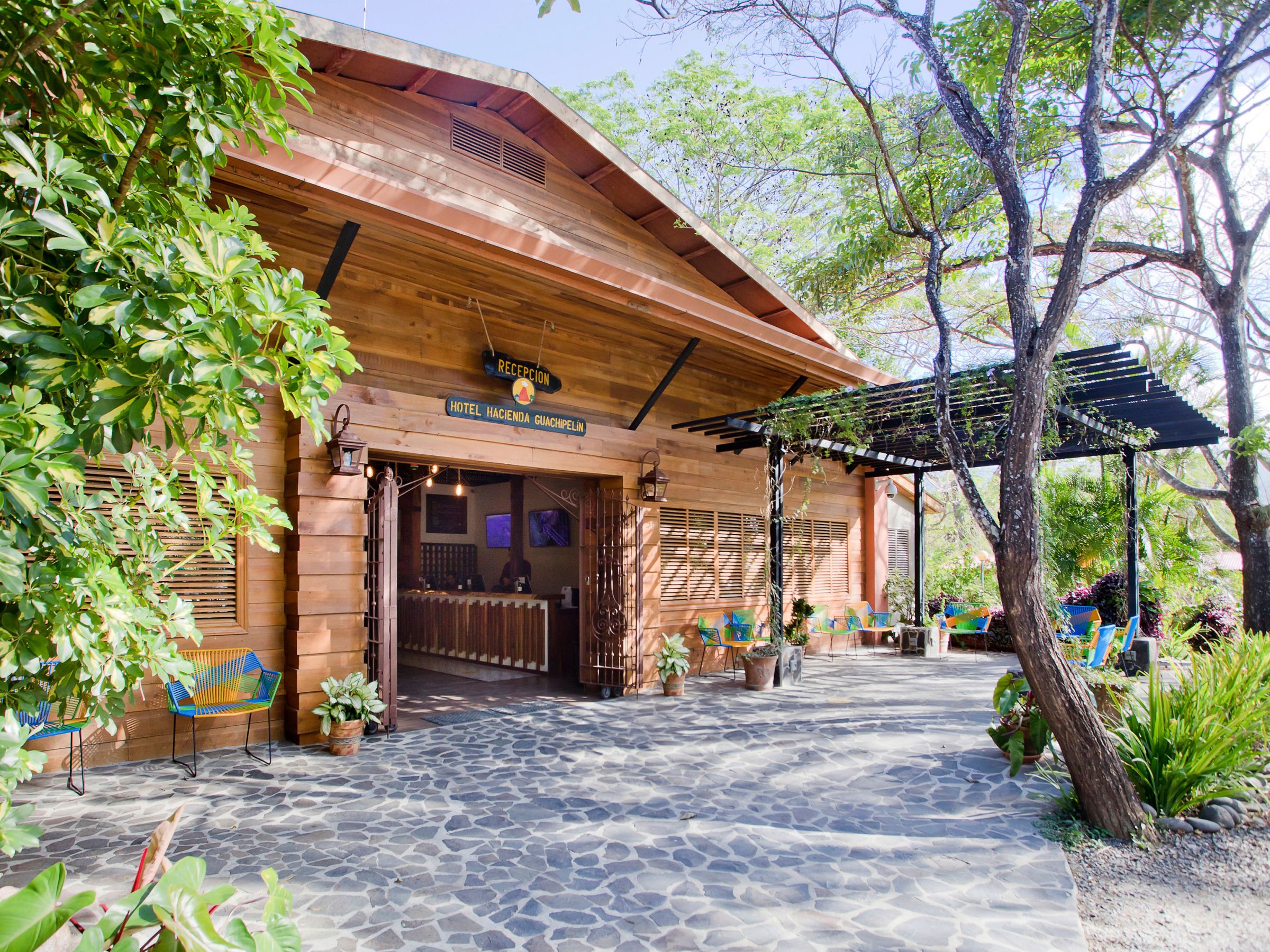 a tree in front of a house