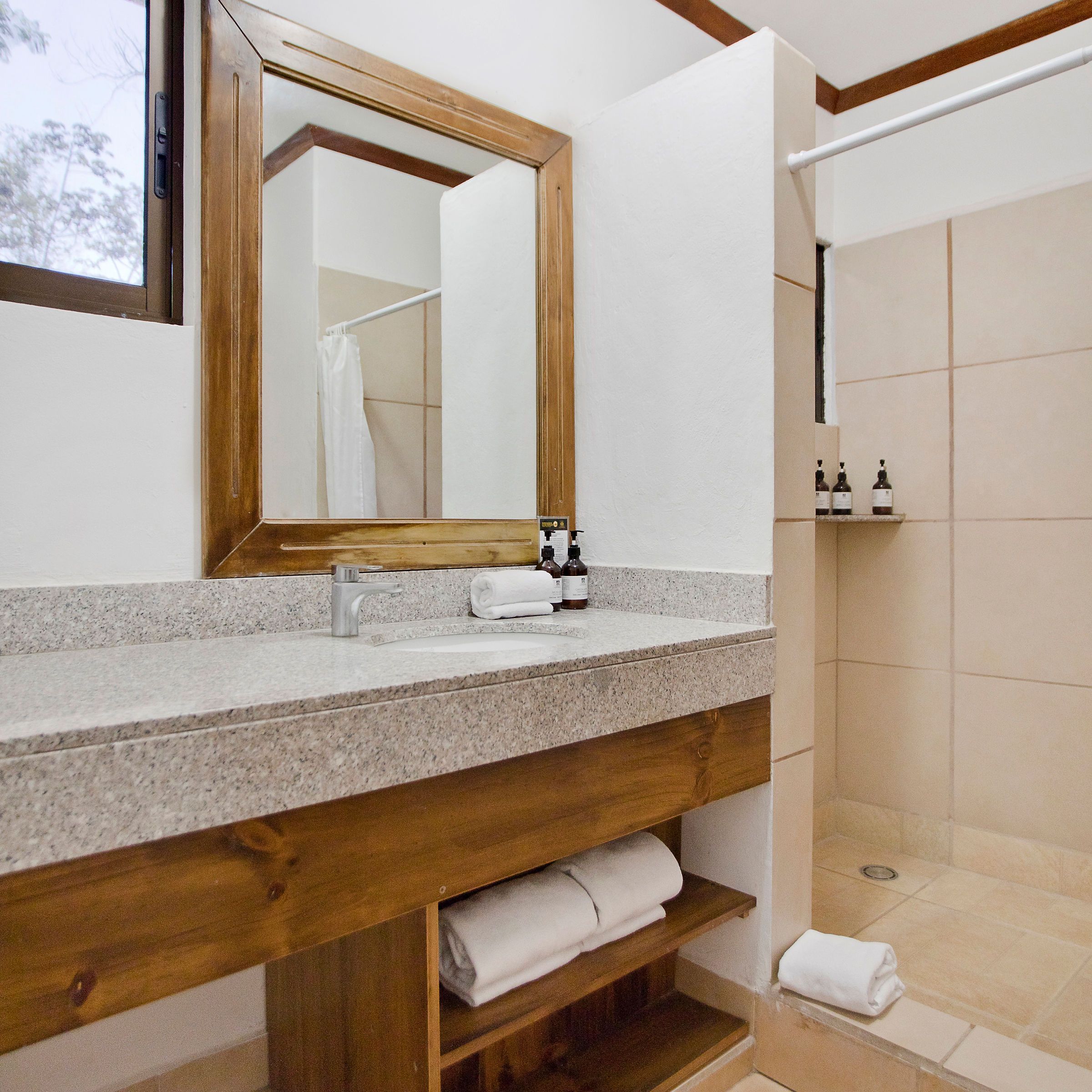 a room with a sink and a mirror