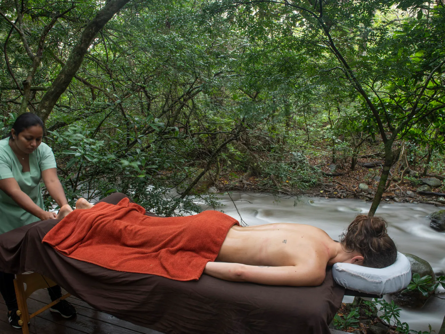 a man and a woman sitting in a tree