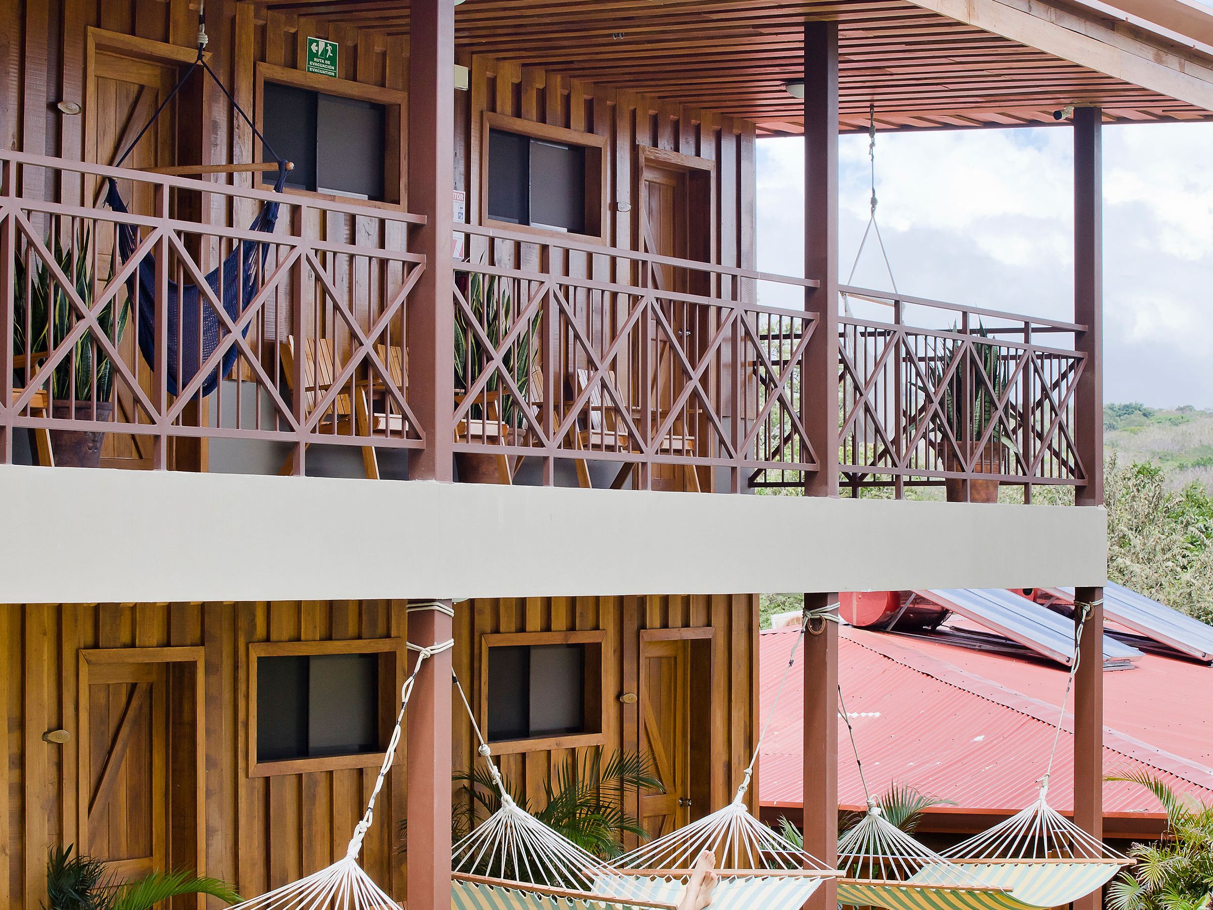 a couple of lawn chairs sitting on top of a building
