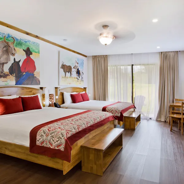 a bedroom with a large bed in a room