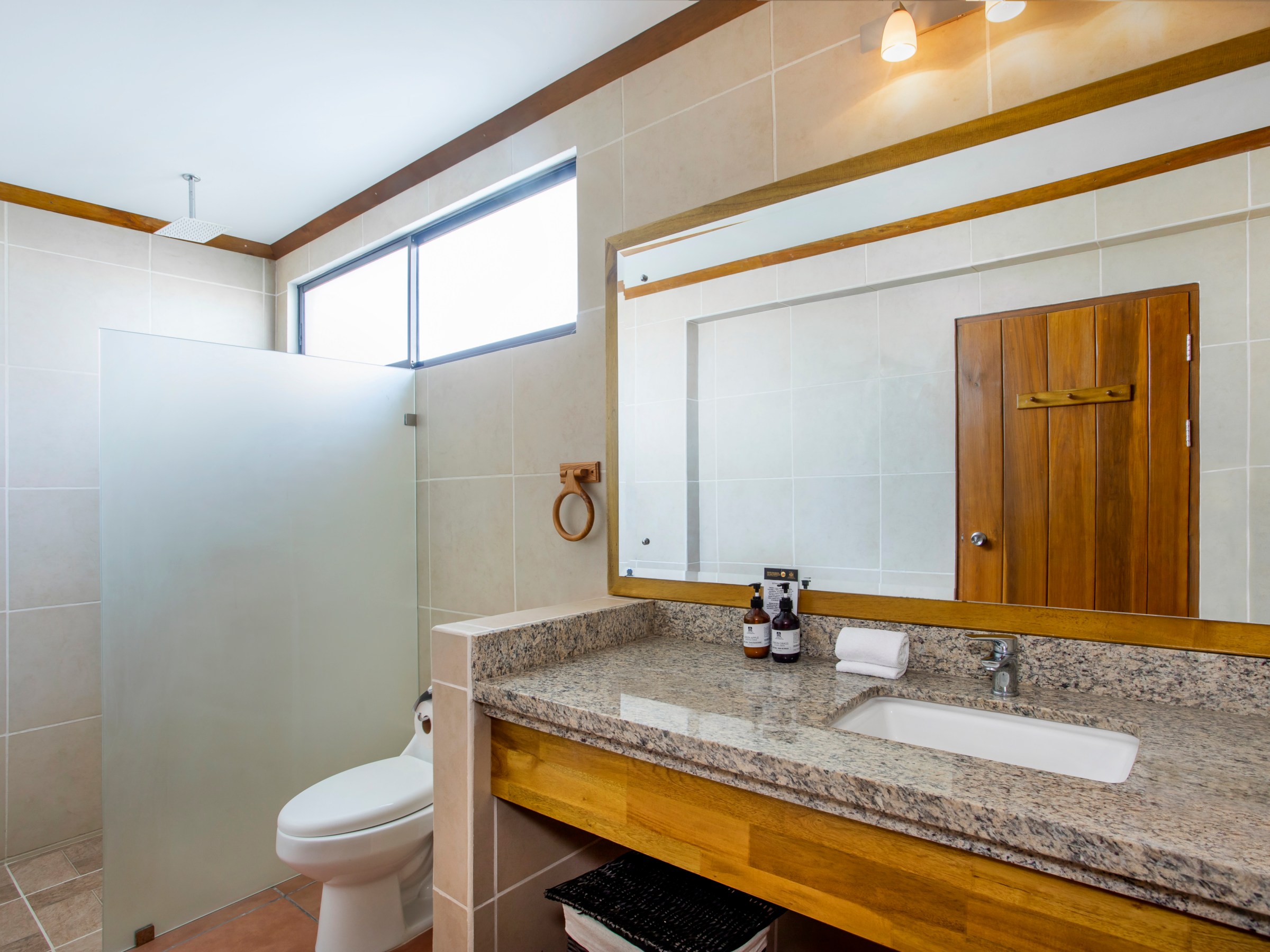 a room with a sink and a mirror