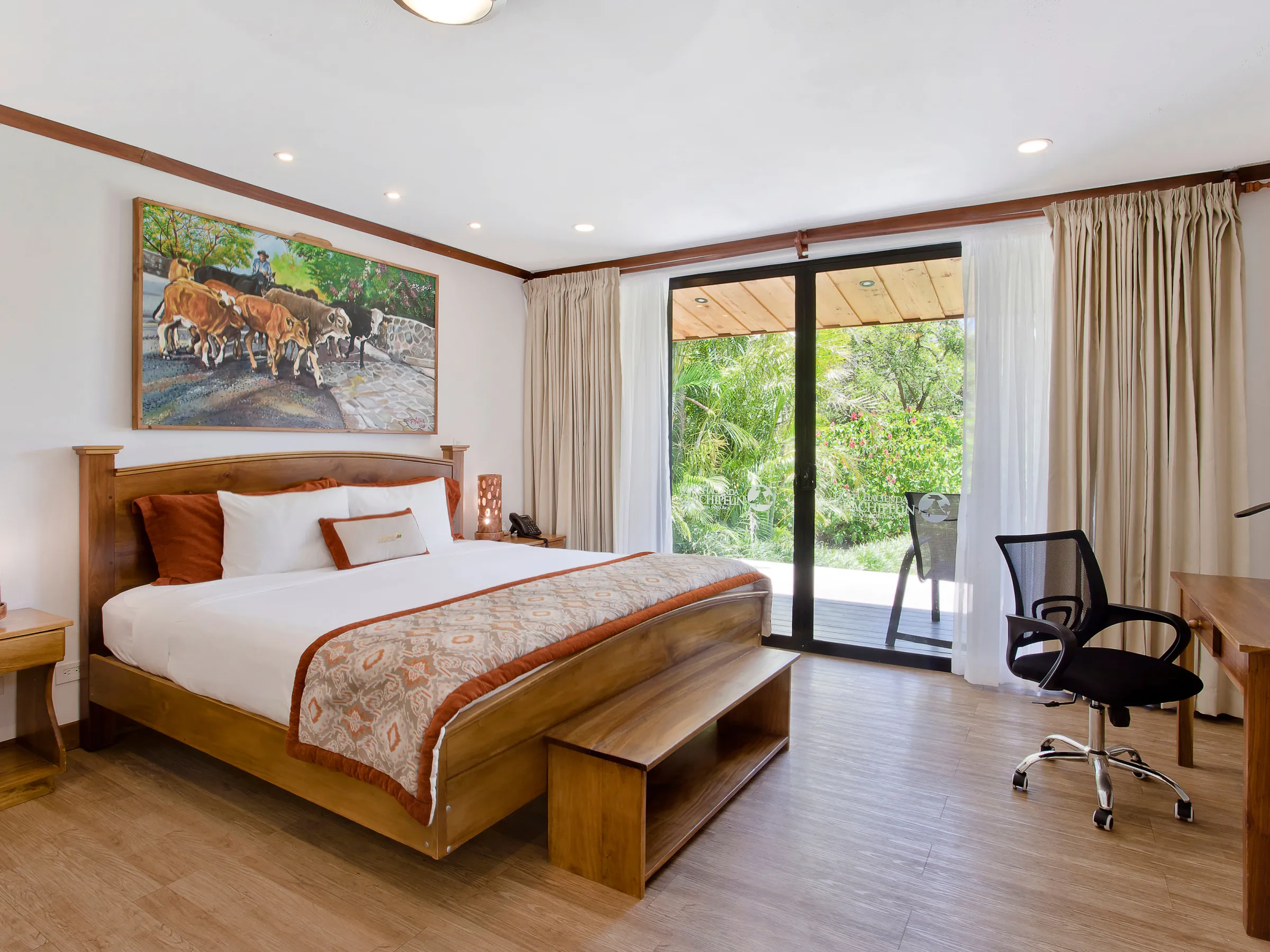 a bedroom with a bed and a chair in a room