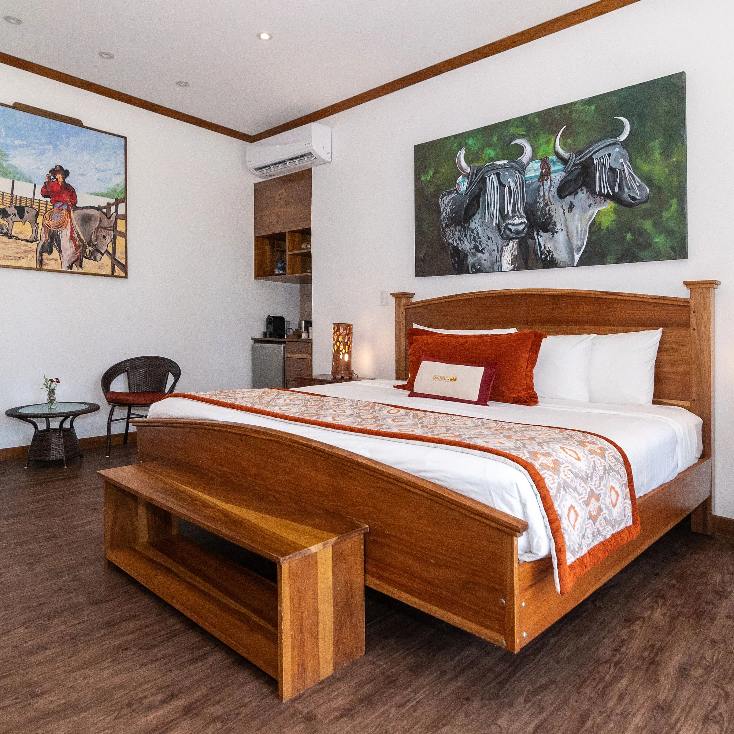 a bedroom with a bed and desk in a room