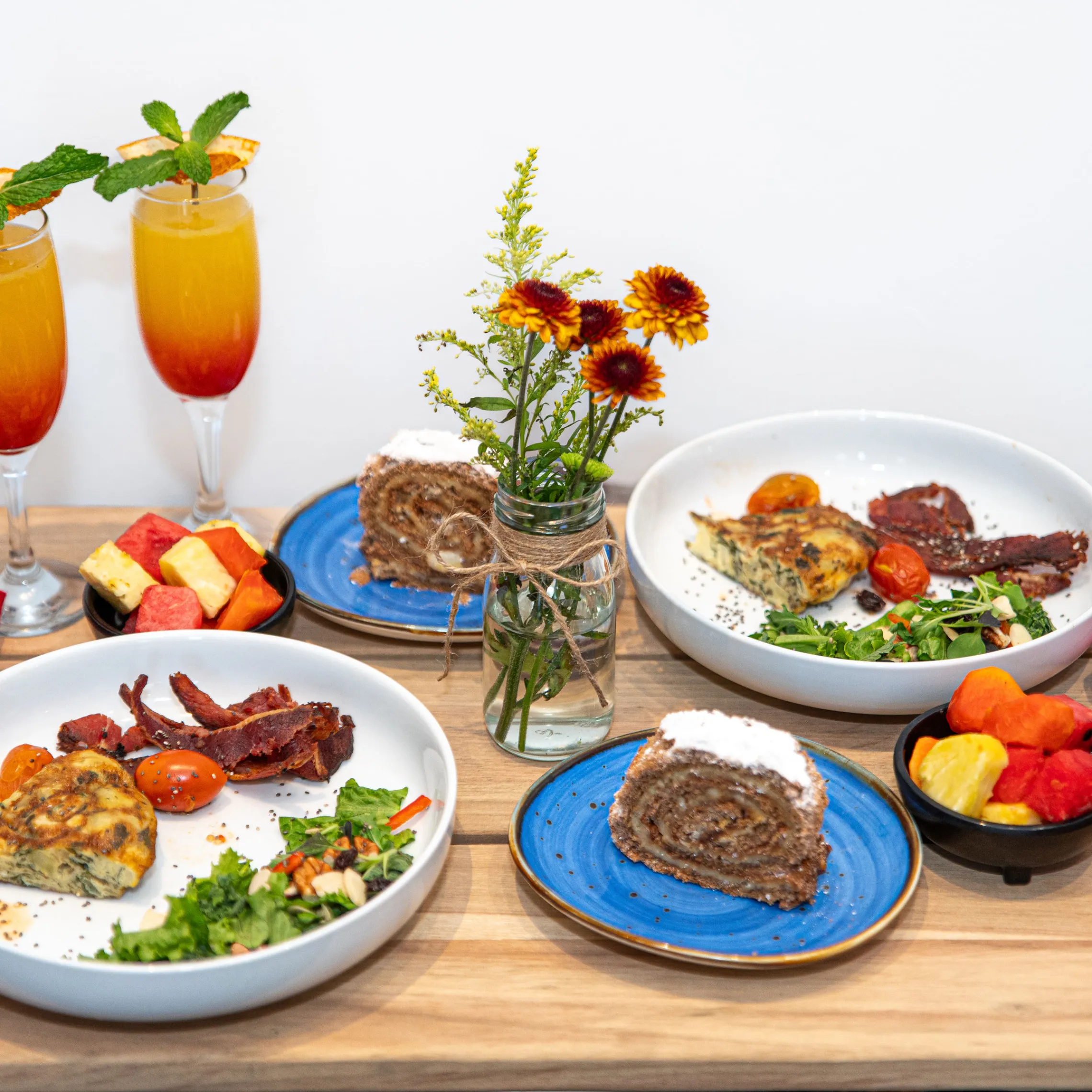 a table topped with plates of food on a plate