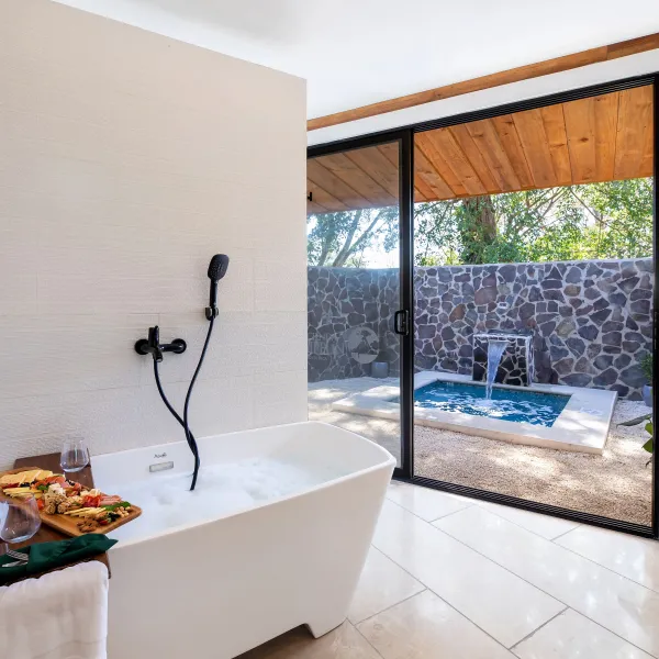 a stack of flyers on a table next to a window