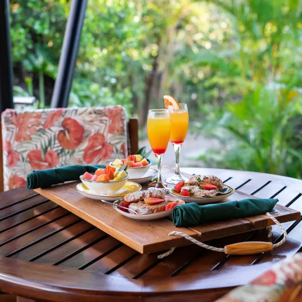 a cake sitting on top of a wooden picnic table