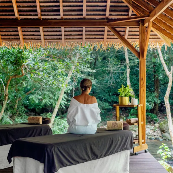 a person sitting on a wooden table