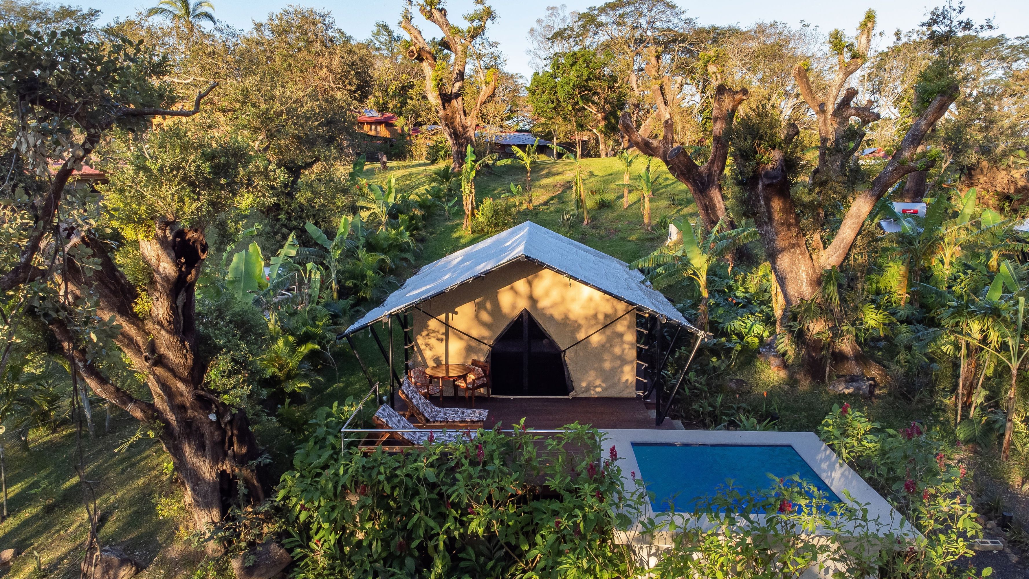 Luxury glamping tent surrounded by tropical dry forest at Hacienda Guachipelin in Guanacaste, Costa Rica